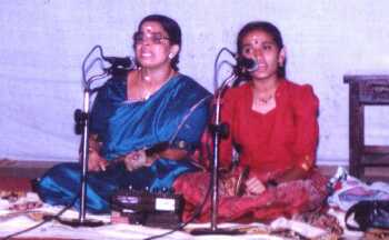 Mrs.T.N.Aryadevi performing Kathakalipadakacheri assisted by Keerthi